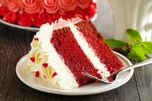 Homemade cake "Red Velvet" decorated with cream.
